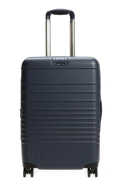 Shop Beis 21-inch Rolling Spinner Suitcase In Navy