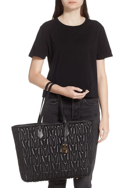 Shop Moschino M Logo Quilted Leather Tote In Fantasy Print Black
