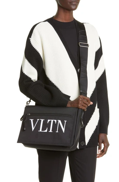 Shop Valentino Vltn Messenger Bag In 0ni - Nero/ Bianco