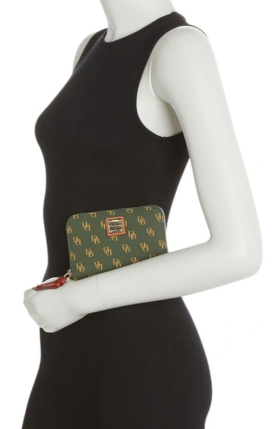 Shop Dooney & Bourke Medium Leather Zip Around Wallet In Ivy