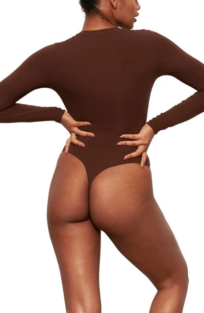Shop Skims Fits Everybody Long Sleeve Crewneck Bodysuit In Cocoa