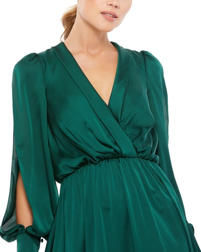 Ieena For Mac Duggal Split Long Sleeve Faux Wrap Satin Gown In Deep Emerald