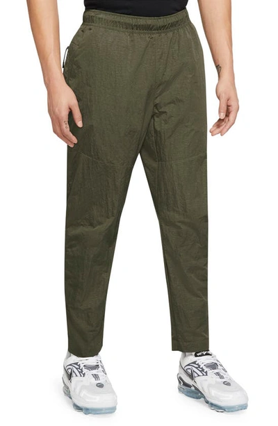 Shop Nike Sportswear Tech Essentials Unlined Woven Joggers In Medium Olive/ Black