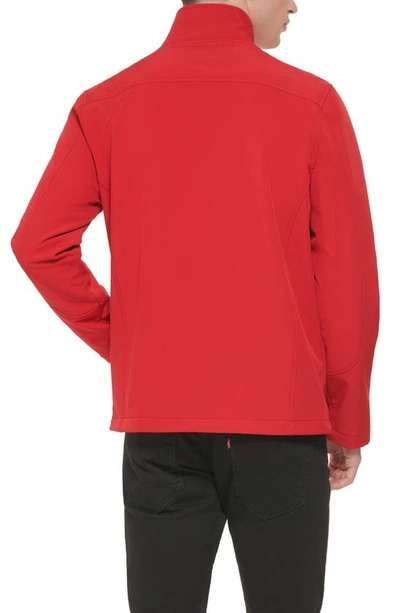 Shop Guess Stand Collar Softshell Rain Jacket In Fire Red