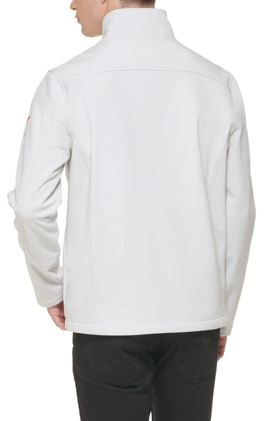 Shop Guess Stand Collar Softshell Rain Jacket In White