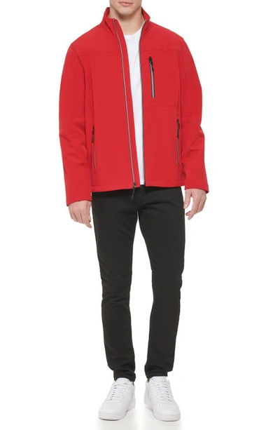 Shop Guess Stand Collar Softshell Rain Jacket In Fire Red