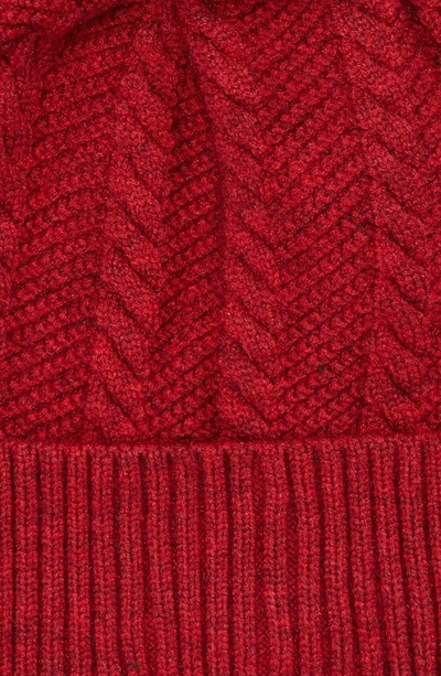 Shop Tasha Cable Knit Pompom Beanie In Raspberry Wine