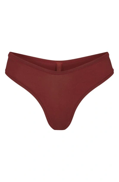 Shop Skims Cotton Jersey Dipped Thong In Sangria