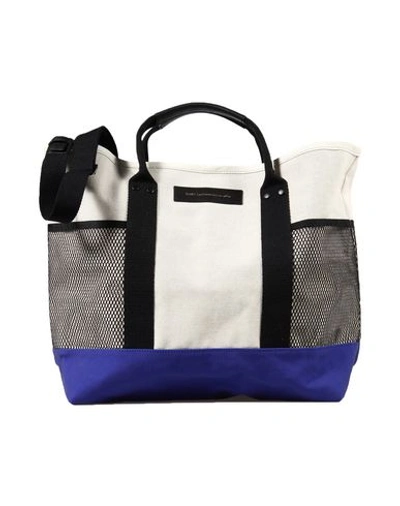 Want Les Essentiels De La Vie Handbags In Bright Blue