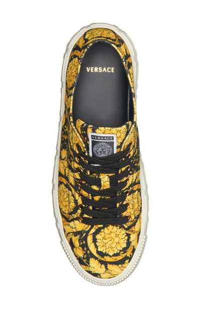 Shop Versace Greca Barocco Print Low Top Sneaker In Black Gold Black- Gold