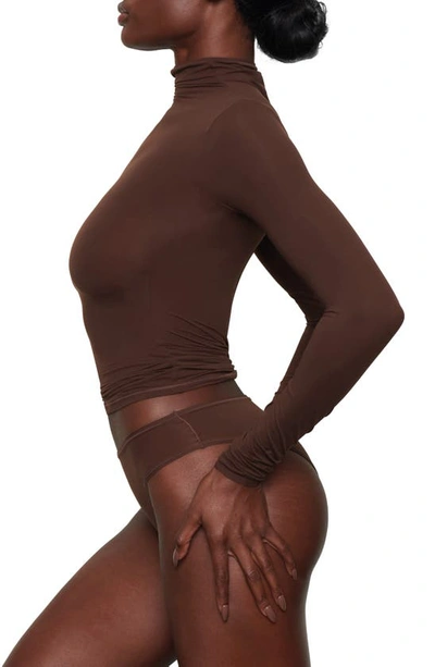 Shop Skims Fits Everybody Funnel Neck Top In Cocoa
