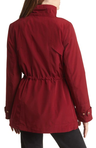 Gallery Cinched Waist Hooded Raincoat In Merlot