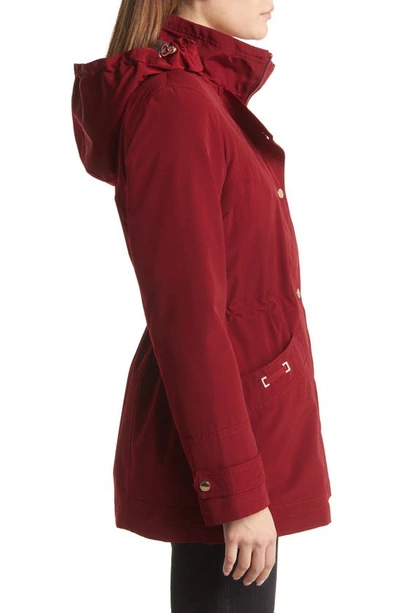Gallery Cinched Waist Hooded Raincoat In Merlot