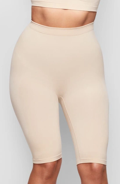 Shop Skims Sculpting Above The Knee Shorts In Clay