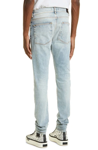 Shop Amiri Stack Distressed Slim Fit Jeans In Stone Indigo