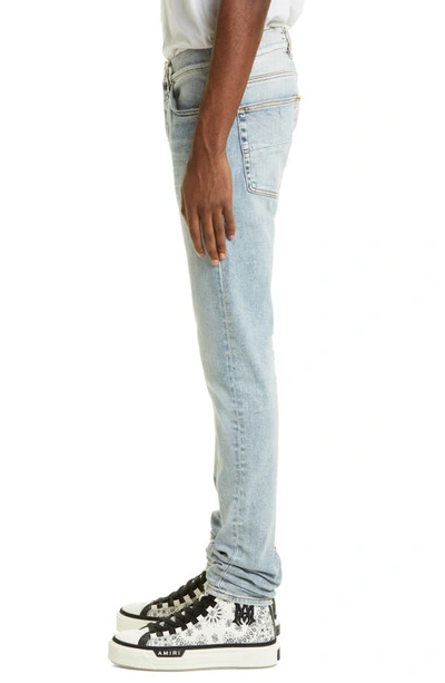 Shop Amiri Stack Distressed Slim Fit Jeans In Stone Indigo