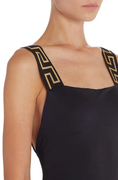 Shop Versace Greca Strap One-piece Swimsuit In A1008 Black
