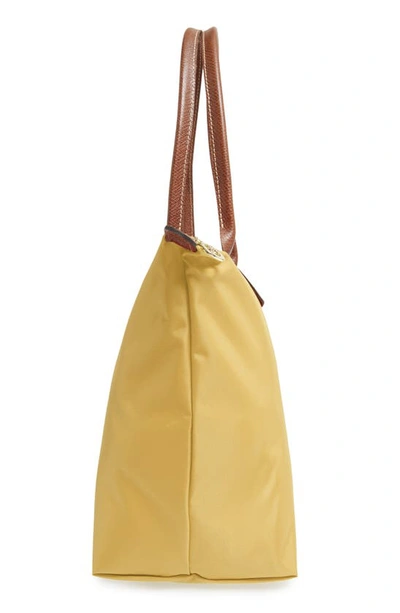 Shop Longchamp Large Le Pliage Tote In Curry
