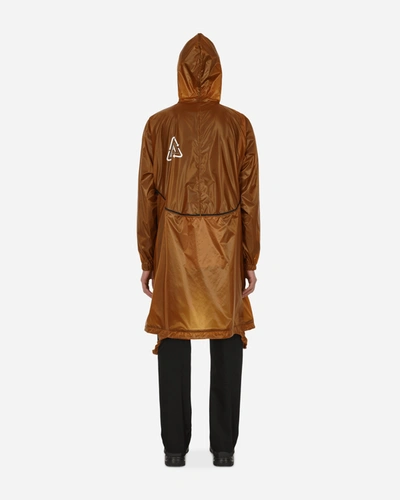 Undercover Convertible Packable Logo-print Nylon-ripstop Hooded Jacket In Brown