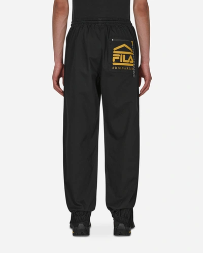 Shop Aries Fila Logo Twill Trackpants In Black