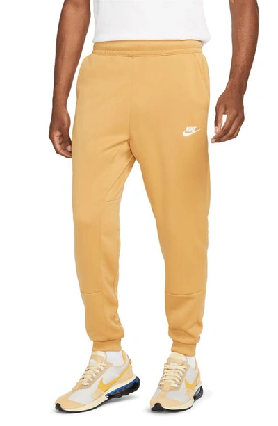 Shop Nike Sportswear Pocket Joggers In Elemental Gold/ White