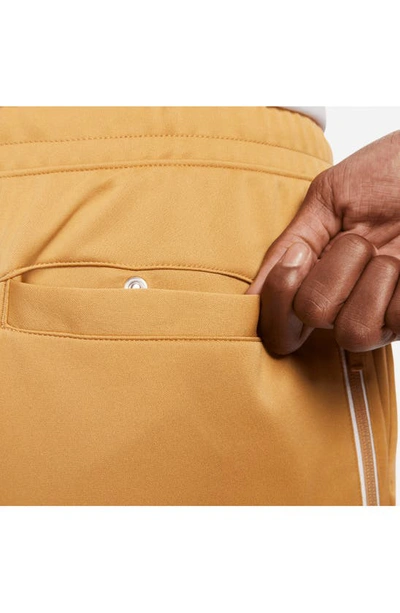 Shop Nike Sportswear Pocket Joggers In Elemental Gold/ White