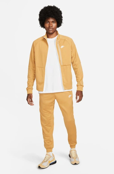 Shop Nike Sportswear Pocket Joggers In Elemental Gold/ White