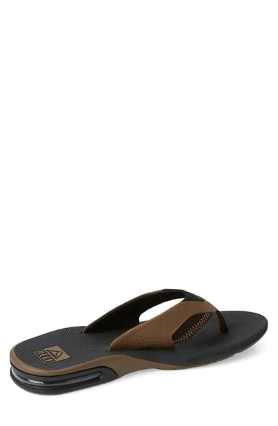 Shop Reef Fanning Low Flip Flop In Black And Tan