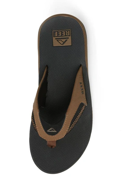 Shop Reef Fanning Low Flip Flop In Black And Tan