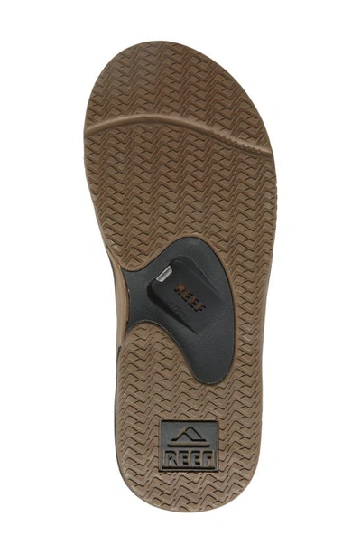 Shop Reef Fanning Low Flip Flop In Black And Tan