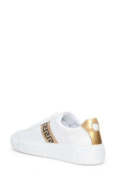 Shop Versace Greca Low Top Sneaker In White/ Gold