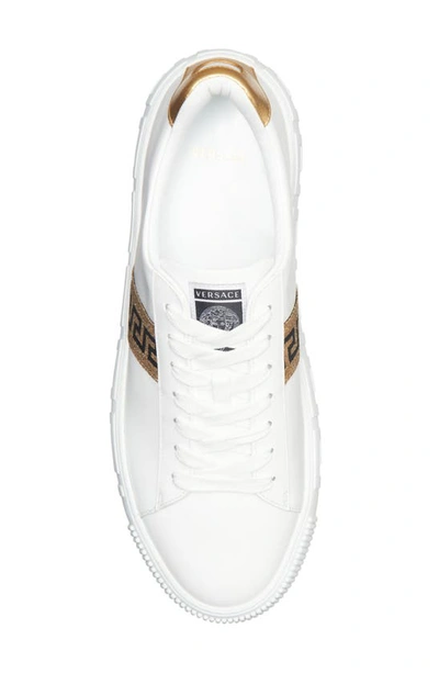 Shop Versace Greca Low Top Sneaker In White/ Gold