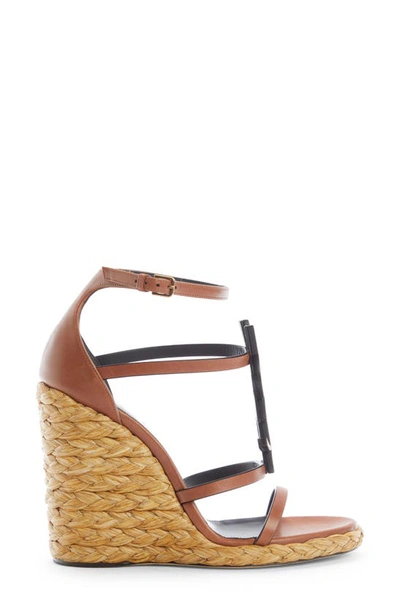 Shop Saint Laurent Cassandra Ysl Logo Raffia Wedge Sandal In New Papaya