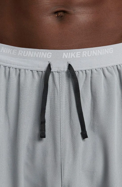 Shop Nike Dri-fit Phenom Woven Running Pants In Smoke Grey/ Reflective Silver