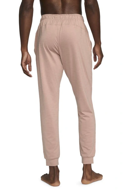 Shop Nike Pocket Yoga Pants In Pink Oxford/ Rose Whisper