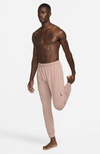 Shop Nike Pocket Yoga Pants In Pink Oxford/ Rose Whisper