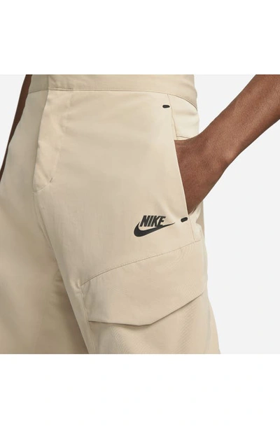 Shop Nike Sportswear Tech Essential Cargo Pants In Sanddrift/ Black