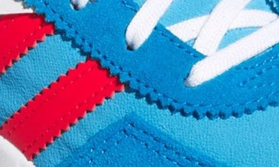 Shop Adidas Originals Kids' Retropy F2 Sneaker In Sky Rush/ Vivid Red/ Blue Rush