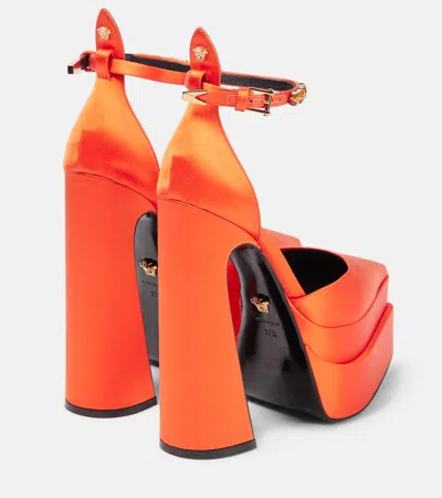 Versace Aevitas Pointy Satin Platform Pumps In Orange-oro