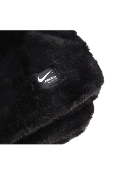 Shop Nike Swoosh Faux Fur Throw Blanket In Black/ White