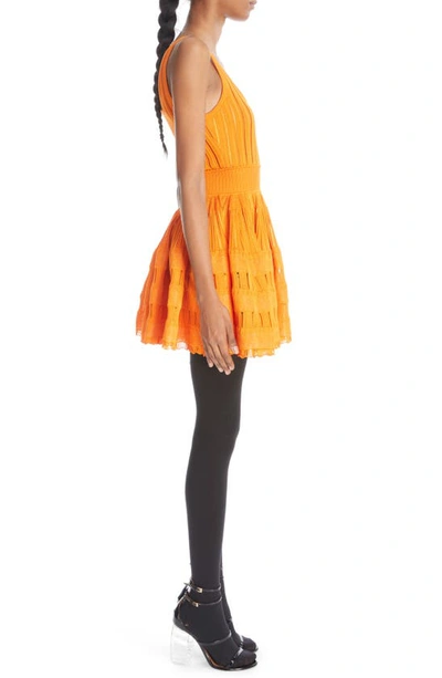 Shop Alaïa Mixed Stitch Sleeveless Skater Dress In Orange