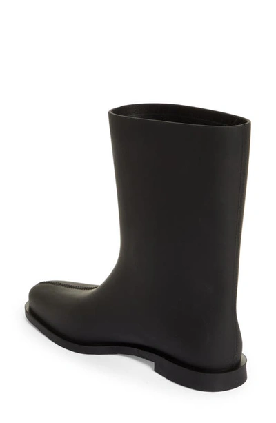 Shop Totême The Rain Boot In Black