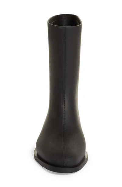 Shop Totême The Rain Boot In Black