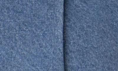 Edikted Belted Pleated Low Rise Denim Microminiskirt In Blue
