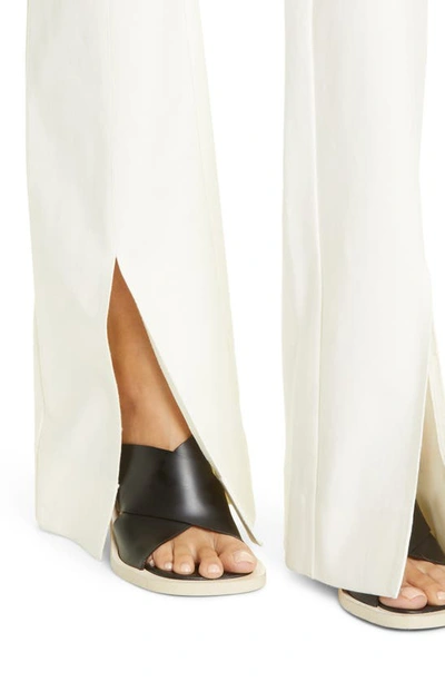Shop Derek Lam 10 Crosby Maeve Slit Hem Stretch Cotton Flare Trousers In Soft White