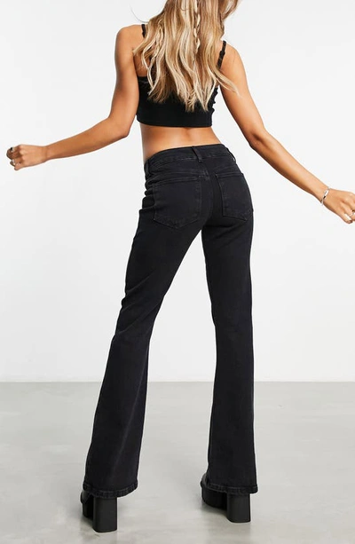 Shop Asos Design Belted Flare Jeans In Black