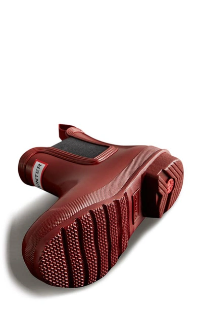 Shop Hunter Original Gloss Waterproof Chelsea Boot In Fall Red/ Black