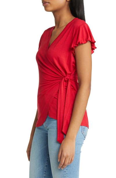 Shop Loveappella Flutter Sleeve Jersey Wrap Top In Red