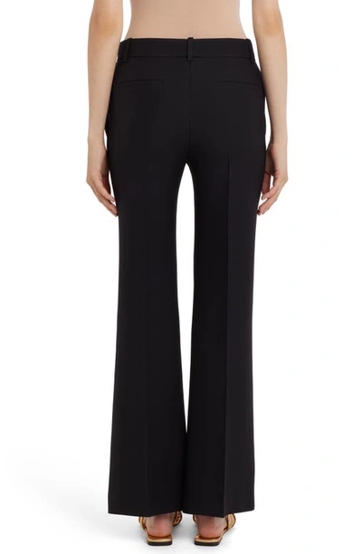 Shop Valentino Flare Crepe Couture Pants In 0no-nero