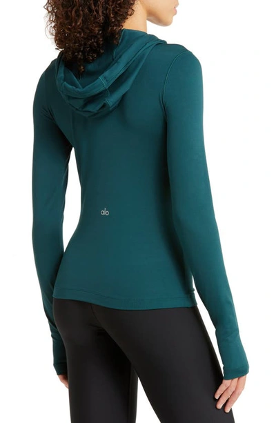 Shop Alo Yoga Visionary Alosoft Hooded Pullover In Midnight Green